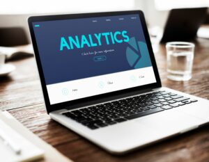 "Text on a laptop screen that says 'Analytics.'